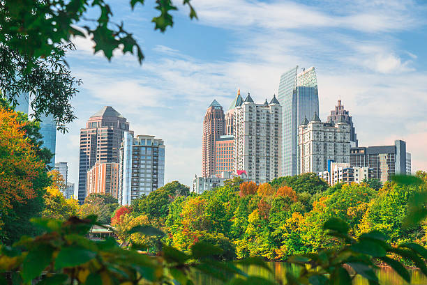 Midtown Atlanta Skyline in Fall A view of the Midtown Atlanta skyline from Piedmont Park during the fall season. atlanta stock pictures, royalty-free photos & images
