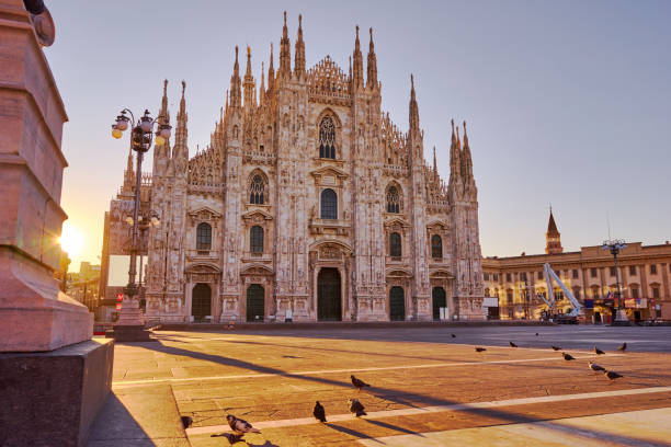 Milan Cathedral at sunrise The Duomo di Milano (Milan Cathedral) with the Piazza del Duomo cathedral stock pictures, royalty-free photos & images