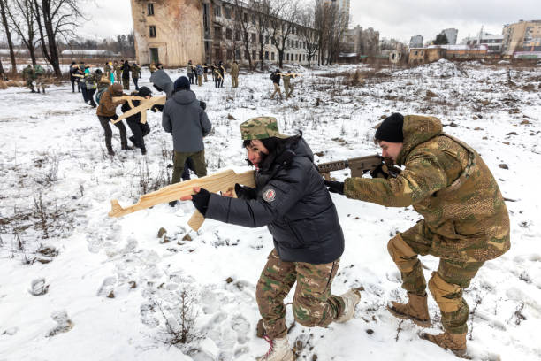 Military exercises for civilians in Kyiv, Ukraine KYIV, UKRAINE - Feb. 12, 2022: Territorial defense exercises amid the threat of a Russian military invasion of Ukraine. Military exercises for civilians in Kyiv, Ukraine military invasion stock pictures, royalty-free photos & images