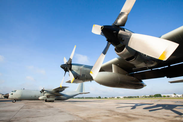 Military transport aircraft on runway at an airport. stock photo