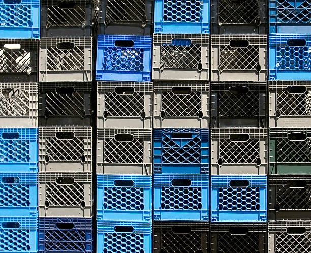 Milk Crates A wall of empty, multi-colored milk crates Horizontal.-For more jars, boxes, containers, bottles, and bags click here.  JARS, BOXES, CONTAINERS, BOTTLES, and BAGS  crate stock pictures, royalty-free photos & images