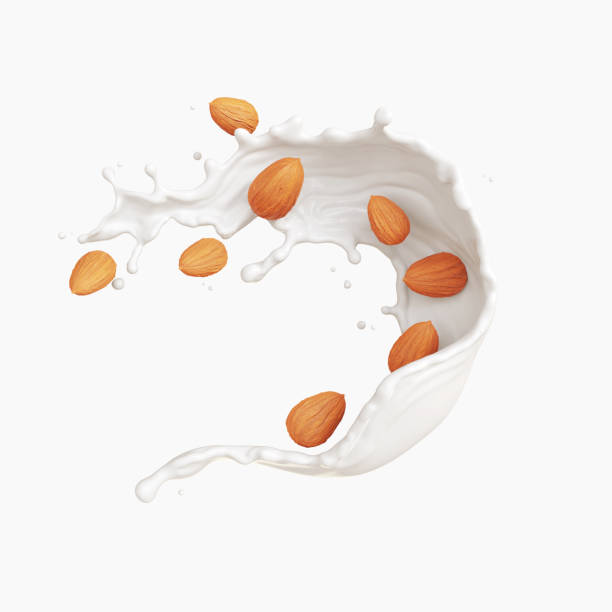 Milk splash with almond seed stock photo