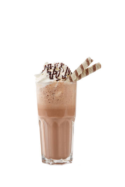 Milkshake with waffle, syrup, straw isolated white stock photo