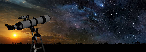 milky way and telescope in the foreground stock photo