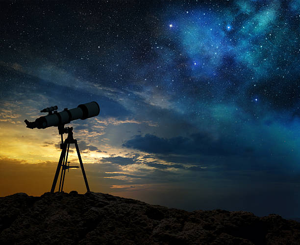 milky way at dawn and silhouette of a telescope - astronomie stockfoto's en -beelden