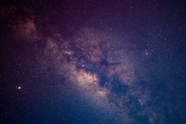 milky way galaxy and starfield on night sky background - milky way imagens e fotografias de stock