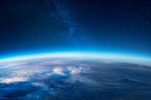 Milky way rising over the Earth's horizon View of stars and milky-way above Earth from space copy space stock pictures, royalty-free photos & images