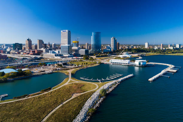 Milwaukee Coast Aerial With Downtown Skyline Aerial view of the Milwaukee skyline and the coast of Milwaukee with Lakeshore State Park in the foreground. lakeshore stock pictures, royalty-free photos & images