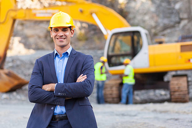 mine manager with arms crossed stock photo
