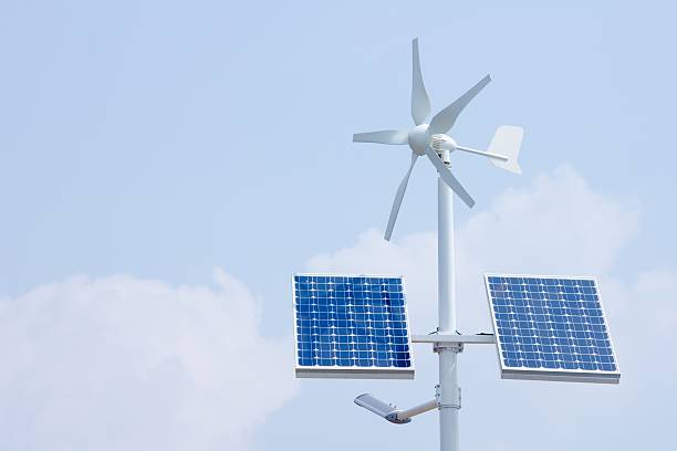 Mini wind power and solar panels Mini wind power and solar panels for domestic use vertical axis wind turbine stock pictures, royalty-free photos & images