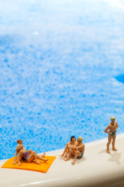 Miniature people: Vacationers are enjoying the beach stock photo