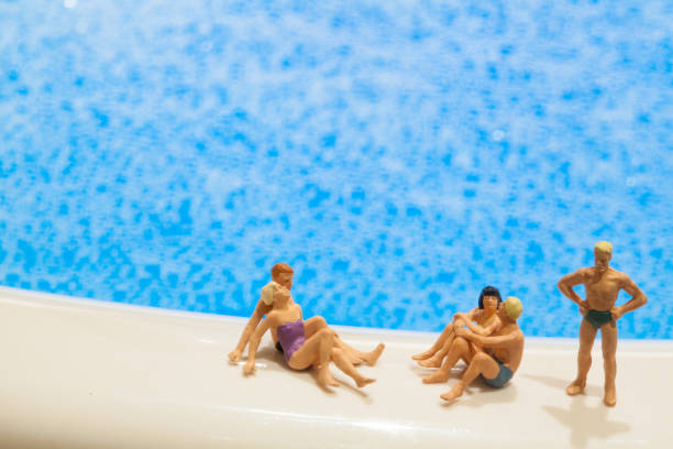 Miniature people: Vacationers are enjoying the beach stock photo