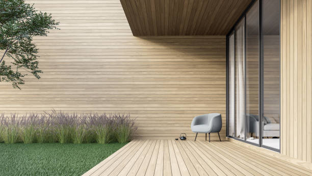 Minimal style wooden terrace with green lawn 3d render stock photo