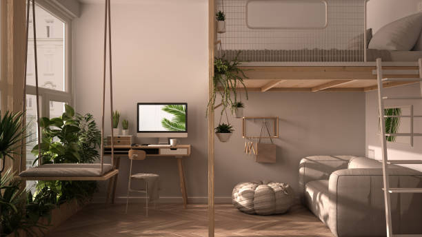 Minimalist studio apartment with loft bunk double bed, mezzanine, swing. Living room with sofa, home workplace, desk, computer. Windows with potted plants, white interior design stock photo