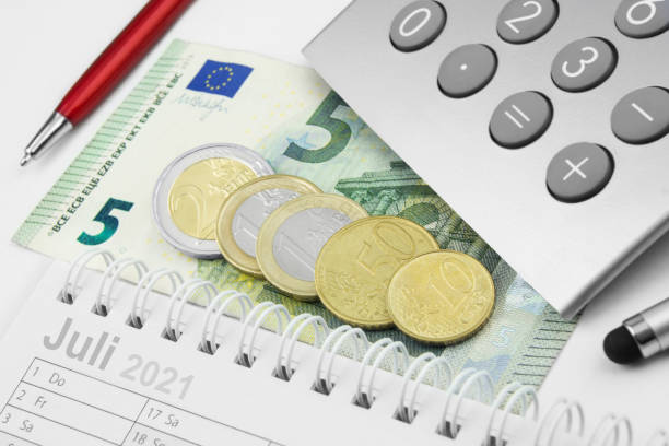 Minimum wage 9,60 Euro and calculator July 2021 stock photo