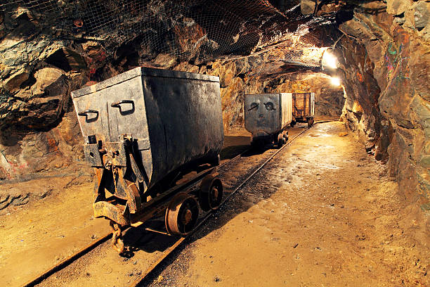 Mining cart in silver, gold, copper mine stock photo