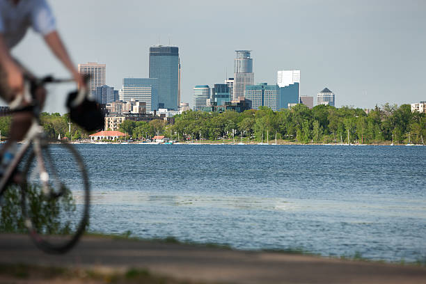 Minneapolis lifestyle scenic with biker on Lake Calhoun. stock photo