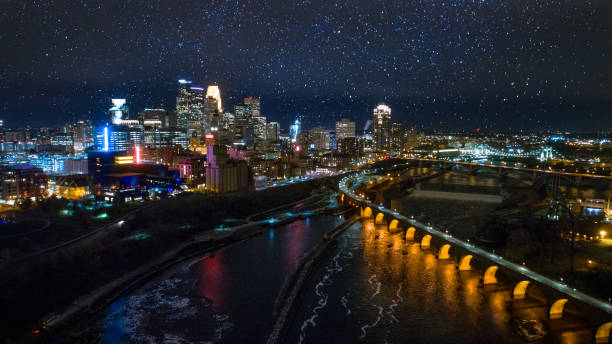 Minneapolis Night Skyline - Downtown & Stone Arch Bridge stock photo