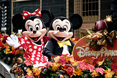 Minnie and Mickey Mouse ride Disney Parks float