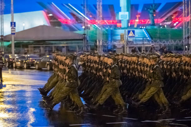 Minsk, Belarus. Soldiers Marching At Street During Night Rehearsal Of Parade Before Celebration Of Independence Day Of Belarus Minsk, Belarus- June 28, 2017:  Soldiers Marching At Street During Night Rehearsal Of Parade Before Celebration Of Independence Day Of Belarus. minsk stock pictures, royalty-free photos & images