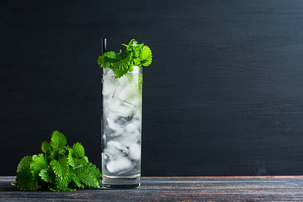 Mint julep in glass Mint julep in glass on the wooden background highball glass stock pictures, royalty-free photos & images