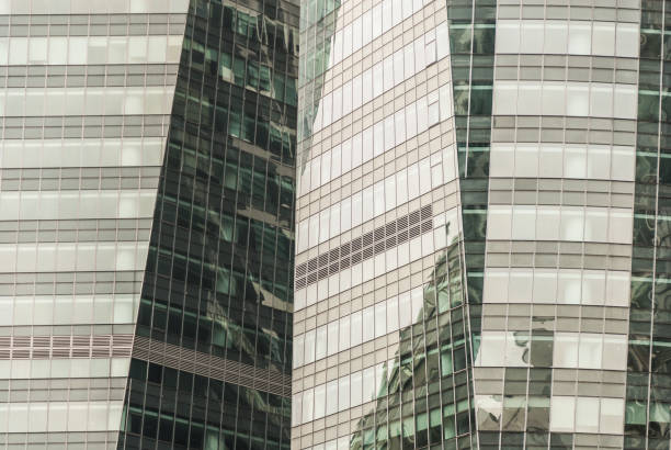 Mirrored walls of big skyscrapers Abstract city background. stock photo