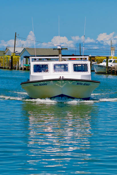 "Miss Jenny" Crab Boat, Tangier Island, Virginia Tangier Island, Virginia / USA - June 21, 2020: The “Miss Jenny” is one of many boats used by local watermen in this popular tourist destination in the Chesapeake Bay. tangier island stock pictures, royalty-free photos & images