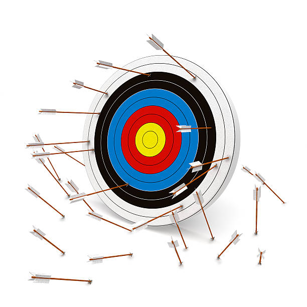 Missing the mark, Multiple arrows missing the target. stock photo