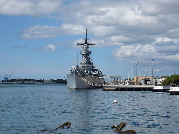 USS Missouri, Pearl Harbor, Honolulu Bow of USS Missouri. USS Arizona memorial in foreground. Control tower in background. pearl harbor stock pictures, royalty-free photos & images