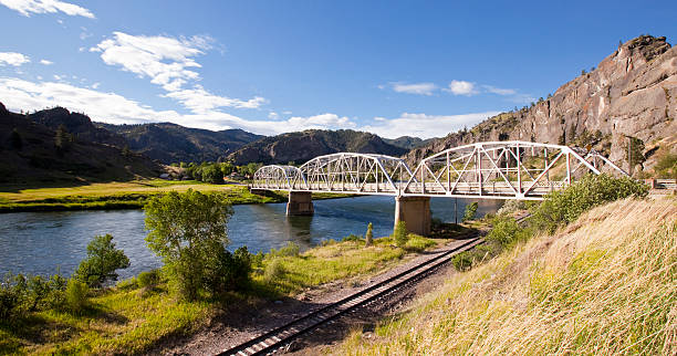 Missouri River Railroad A picturesque afternoon on the Missouri River in between Craig and Cascade in central Montana.  This stretch of the Missouri is recognized as one of the best trout fishing streams in the midwest. montana western usa stock pictures, royalty-free photos & images