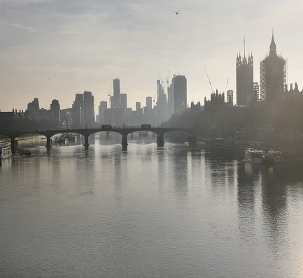 London looking Monet ish in the mist.\nRiver Thames with London skyline looking towards Westminster Bridge