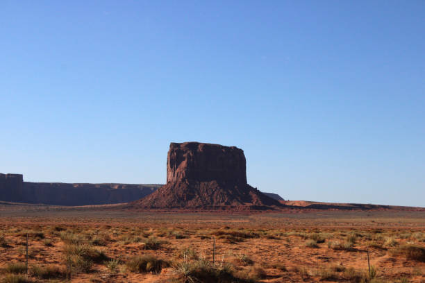 Mitchell Butte Monument Valley Utah Landscape with Blue Sky stock photo