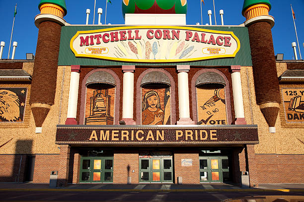 Mitchell's Corn Palace Mitchell, South Dakota, USA - September 18, 2011: The Mitchell Corn Palace in Mitchell, SD is decorated fresh every year with a new design. The mosaics on the outside are made of various naturally colored corn cobs, husks, tassels, and stalks. The theme for 2011 is "American Pride". The facility hosts stage shows, as well as sports events in its arena. terryfic3d stock pictures, royalty-free photos & images