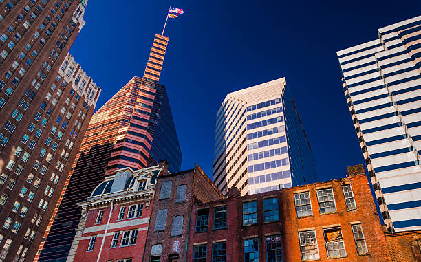 Mix of modern and old buildings in Baltimore, MD "Looking up at a mix of modern and old buildings in Baltimore, Maryland." baltimore maryland stock pictures, royalty-free photos & images