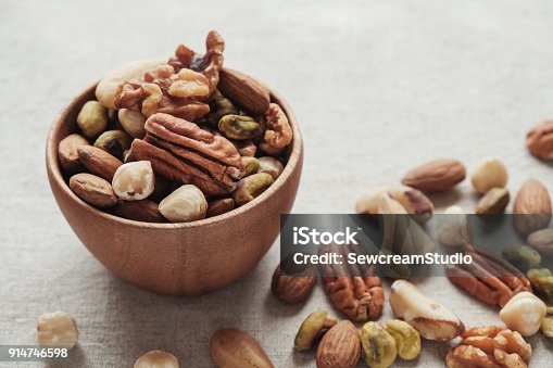 istock mixed nuts in wooden bowl, healthy fat and protein food and snack, ketogenic diet food 914746598