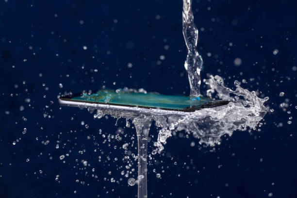 Mobile phone water resistant. Test waterproof mobile phone stock photo