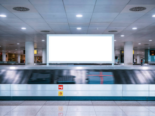 Mock up Signboard Airport Luggage Carousel Conveyor Mock up Signboard Airport Luggage Carousel Conveyor with Baggages on conveyor belt airport terminal photos stock pictures, royalty-free photos & images