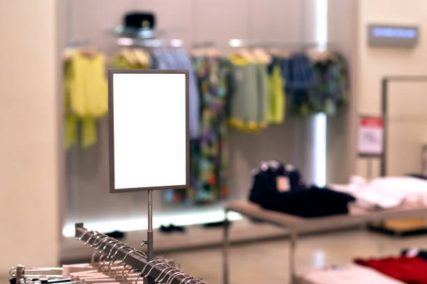Mock up template of sales information banner or tag price in clothing store. Frame with copy space. stock photo
