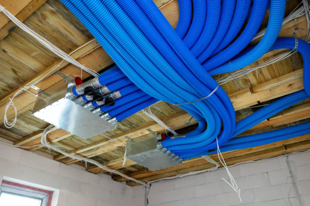 modern air ventilation system installation in the new building stock photo