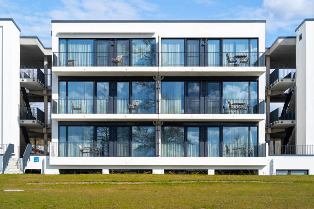 Modern architecture condominiums on the lake. Financial investment housing construction in Hamburg. stock photo