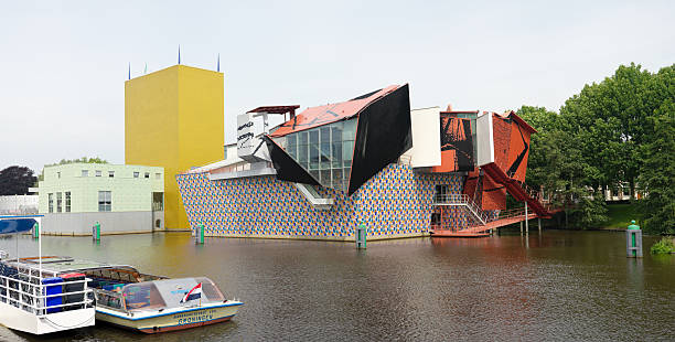 Modern architecture in Groningen, Netherlands Groningen, Netherlands - July 4, 2012: The Groninger museum, designed by different architects like Mendini and Starck, is a famous landmark in Groningen and now on the verge of bankruptcy groningen city stock pictures, royalty-free photos & images