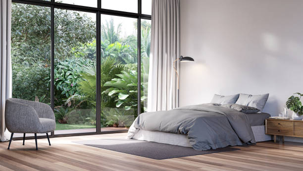 Modern bedroom with tropical style garden view 3d render stock photo