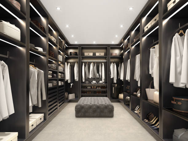 Modern black luxury walk in closet, dressing room, wardrobe 3d render of a modern black luxury walk in closet room with tufted velvet stool and carpet and clothes closet stock pictures, royalty-free photos & images