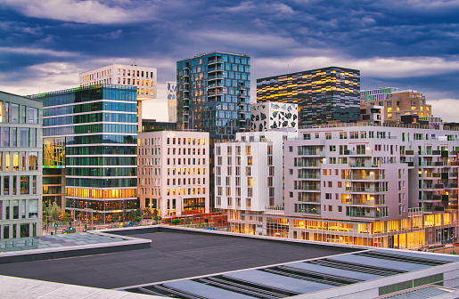 Panoramic view over modern city building in Oslo after sunset, Norway. The night is still illuminated by blue light because of the midnight-sun effect over the north polar circle.