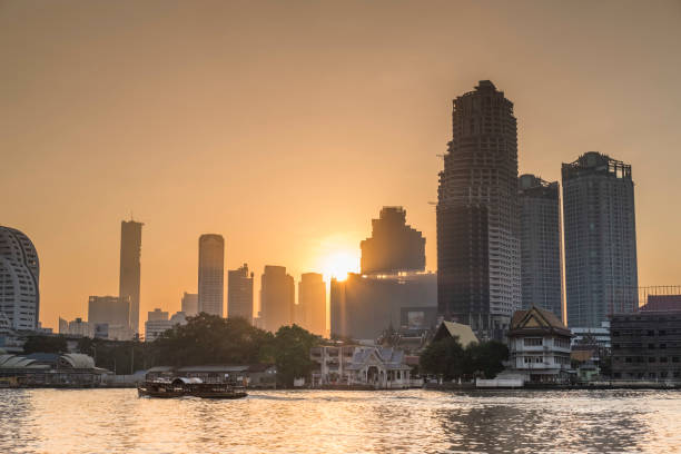 modern city scape along chao phraya riverside stock photo