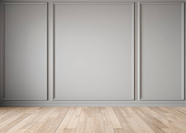 Modern classic gray blank wall with moldings and wood floor. Modern classic gray blank wall with moldings and wood floor. 3d render illustration mock up. moulding trim stock pictures, royalty-free photos & images