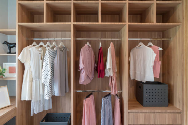 modern closet with clothes hanging stock photo