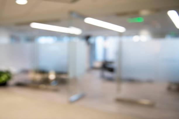Modern Conference Room Background Modern conference room with walls of glass. There is a section of glass that is frosted. It is bright and airy. The entrance to the conference room is open. fluorescent light photos stock pictures, royalty-free photos & images