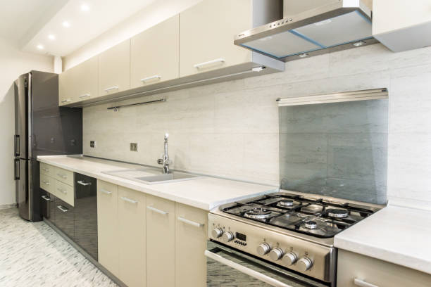 Modern creamy white kitchen clean interior design stock photo