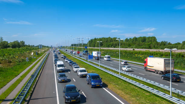 Modern dutch highway A4, afternoon traffic jam direction Rotterdam, Netherlands stock photo
